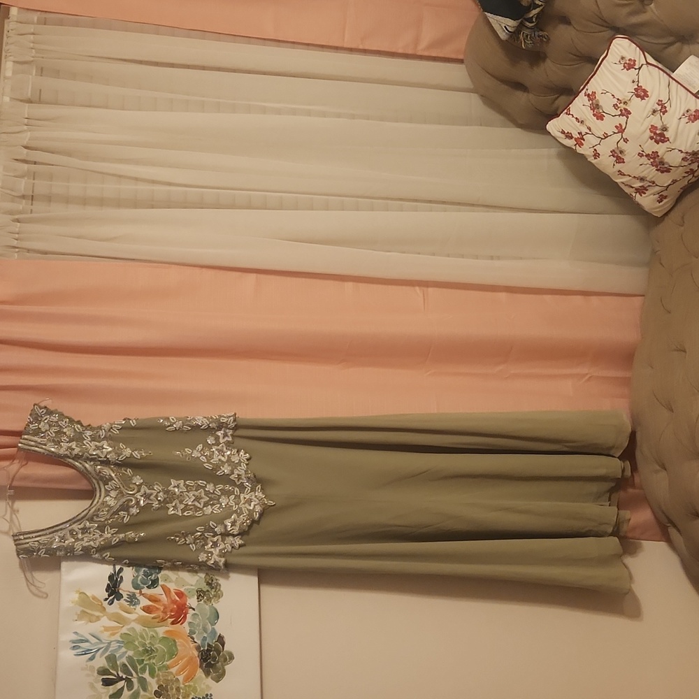 A full length lined jade color prom gown sized 12 by JK ARA NEW YORK  $40.